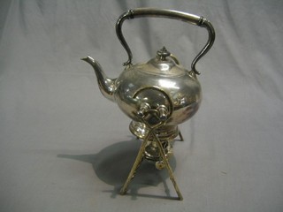 A Britannia metal tea kettle and stand, raised on crab stock supports complete with burner