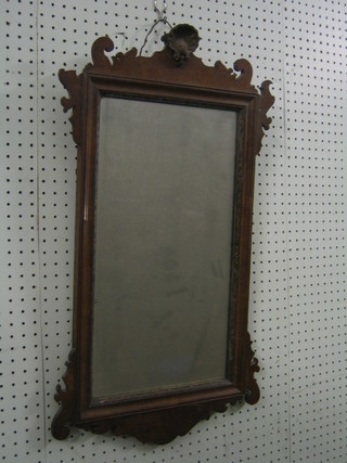 An 18th/19th Century Chippendale style rectangular plate mirror contained in a walnut frame with shell mount to the top 29" (some damage)
