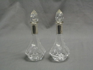 A pair of Art Deco Continental scent bottles with silver collars, 6"