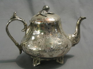 An engraved silver plated teapot