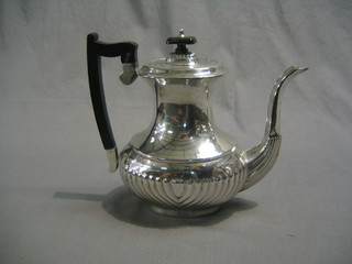 A silver plated coffee pot with demi-reeded decoration