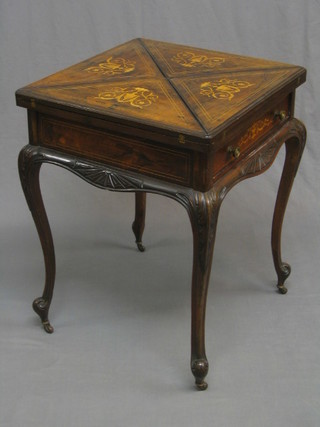 An Edwardian inlaid rosewood envelope card table, the base fitted a drawer and raised on carved cabriole supports, 22 1/2" (veneers slightly lifting)