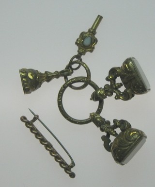 A 9ct gold bar brooch in the form of a rope twist and 3 gilt metal seals