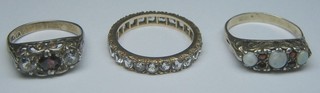 An eternity ring set white stones and 2 dress rings
