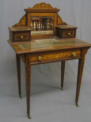 A Victorian inlaid rosewood writing table, the back fitted a bevelled plate mirror flanked by a pair of drawers, with inset tooled leather writing surface, the base fitted 1 long drawer, raised on square tapering supports ending in brass caps and castors 30"