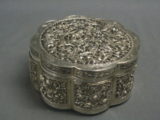 A circular pierced Eastern silver trinket box with hinged lid 6", 11 ozs