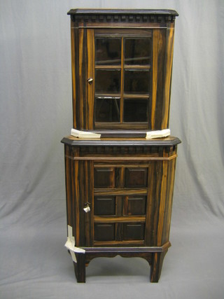 A Victorian Coromandel double corner cabinet, the upper section with dentil cornice, the interior fitted adjustable shelves enclosed by an astragal glazed door, the base enclosed by a panelled door, raised on square feet 24"