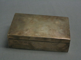 A plain rectangular silver cigarette box with hinged lid, Birmingham 1929 (marks rubbed) 6"