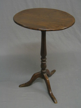 A 19th Century circular mahogany wine table, raised on pillar and tripod supports 18" (base with old blacksmith's repair)