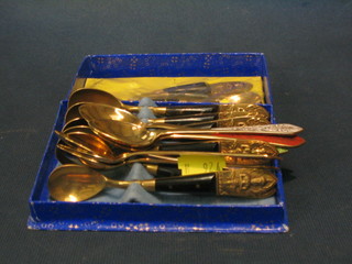 A collection of Thai gilt metal and enamelled tea spoons