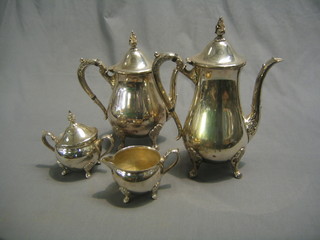 A modern 4 piece silver plated coffee service comprising coffee pot, hotwater jug, twin handled sugar bowl and cover and a cream jug