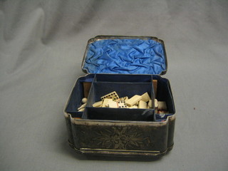 A Victorian games compendium contained in an engraved silver plated box with hinged lid, featuring backgammon board, chessboard, 2 ivory circular balls, 5 ivory skittles (1f), various ivory "jack" straws, 54 ivory dominoes and ivory chess pieces