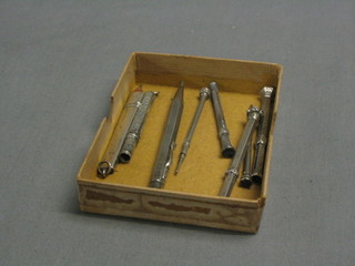 A silver cased propelling pencil, a Continental silver cased propelling pencil and 5 other propelling pencils