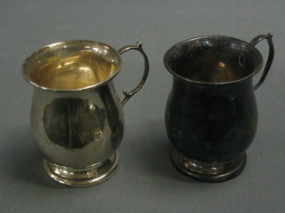 A pair of silver baluster shaped christening tankards, Birmingham 1938, 4 ozs
