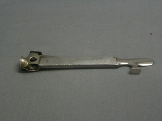 A chromium plated and planished metal cigar cutter 7"