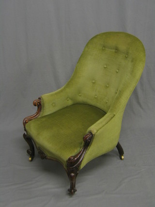 A Victorian mahogany show frame tub back chair, upholstered in green material, raised on cabriole supports