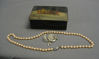 A Russian painted lacquered box with hinged lid 6", containing a string of cultured pearls and a diamonte brooch