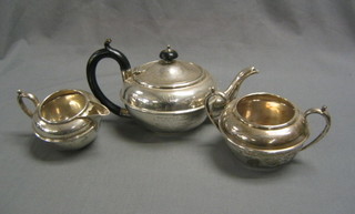 A 3 piece circular silver bachelor's tea service with teapot, twin handled sugar bowl and cream jug, Sheffield 1926, 25 ozs