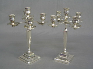 A pair of  modern 5 light silver plated candelabrum