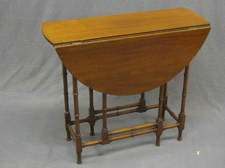 A 19th Century mahogany oval drop flap spiders leg table 30"