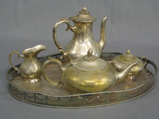 An engraved silver plated 5 piece coffee service with coffee pot, tea pot, lidded sucrier and cream jug and matching tray