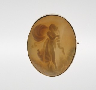 A shell carved cameo brooch in the form of a classical lady contained in gilt metal mounts