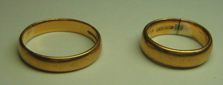 A 22ct gold wedding band and an 18ct gold wedding band
