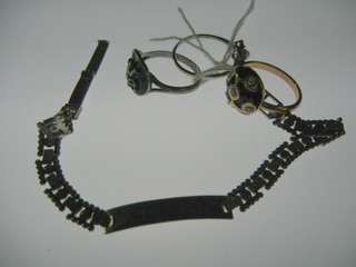 A lady's silver bracelet and 3 dress rings