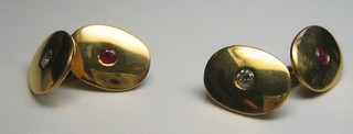 A pair of modern 18ct gold oval cufflinks set rubies and diamonds (approx 0.27ct)