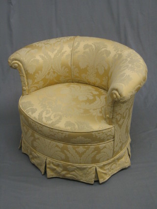 A tub back chair upholstered in yellow material