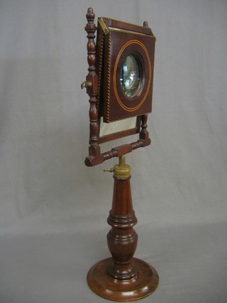 A 19th Century Zogroscope, raised on  a turned and  inlaid mahogany stand