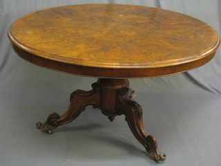 A Victorian snap top figured walnut Loo table, raised on a pillar and tripod base 51"  