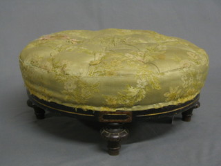 A Victorian circular  ebonised and walnut footstool raised on 4 turned supports 14"
