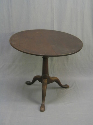 A Georgian mahogany circular snap top tea table, with bird cage action, raised on a gun barrel tripod column (crack to 1 of legs on tripod) 32"