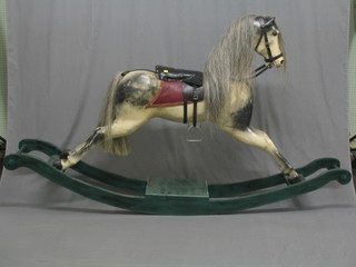 A fine quality large carved wooden dappled rocking horse