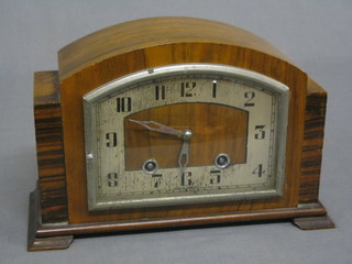 A 1930's 8 day striking mantel clock contained in arched walnut case, the movement Empire Deluxe