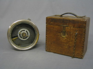 A racing pigeon clock "The Automatic Time Recording Clock Co." contained in a circular chromium plated case, complete with oak carrying case