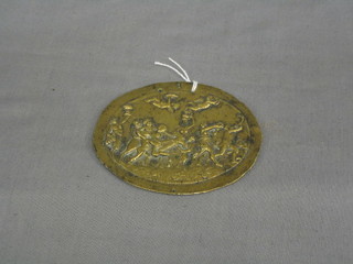 An 18th/19th Century gilt metal plaque depicting classical scenes, 4" oval