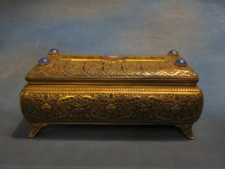 A handsome 19th Century French embossed and engraved brass casket with hinged lid and enamel panel decorated a crowned sypher, the corners set lapis lazuli, raised on bracket feet, the base marked AP 11 1/2" (slight chip to left hand corner lapis) 