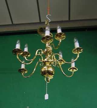 A Dutch style brass 9 light electrolier
