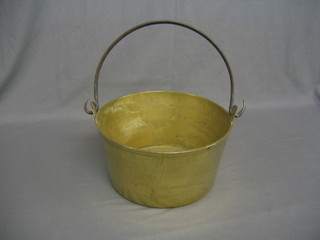 A 19th Century brass preserving pan with steel handle