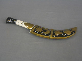A reproduction Jambuka contained in a horn and inlaid brass case