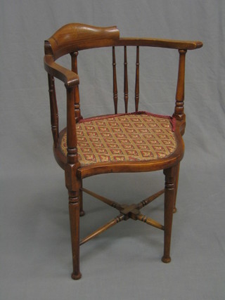 An Edwardian inlaid mahogany stick and bar back corner chair 