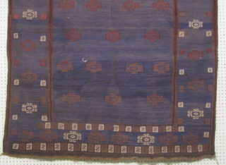A contemporary blue ground Pakistan eating rug with knotted gull to the centre 48" x 47"