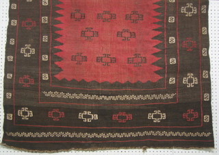 A contemporary Pakistan red ground eating rug 46" x 43"