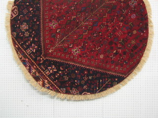 A contemporary red and blue ground Persian rug 58" circular