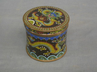 A circular Oriental black ground cloisonne jar and cover decorated a dragon 3"