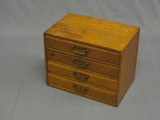 A 19th Century oak stationery chest fitted 4 long drawers 16"