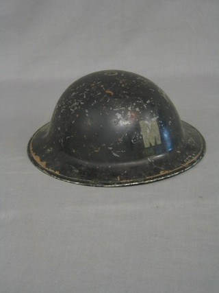 A WWII steel helmet marked M