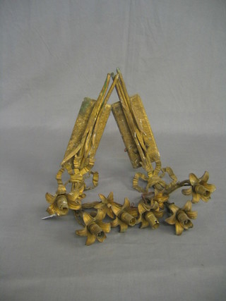 A pair of gilt metal floral patterned 3 light wall brackets
